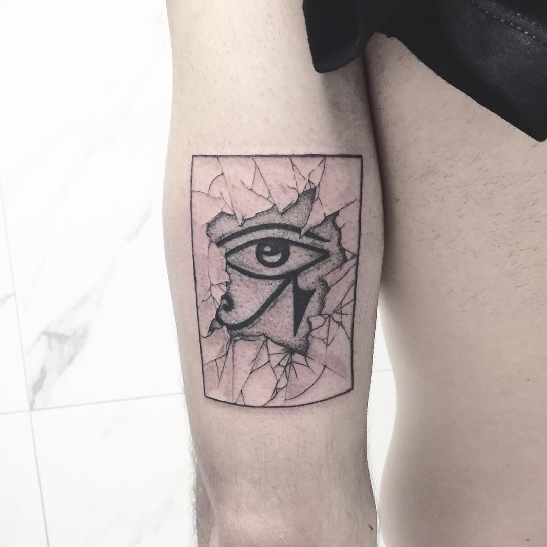 Intriguing cracked skin Egyptian eye tattoo