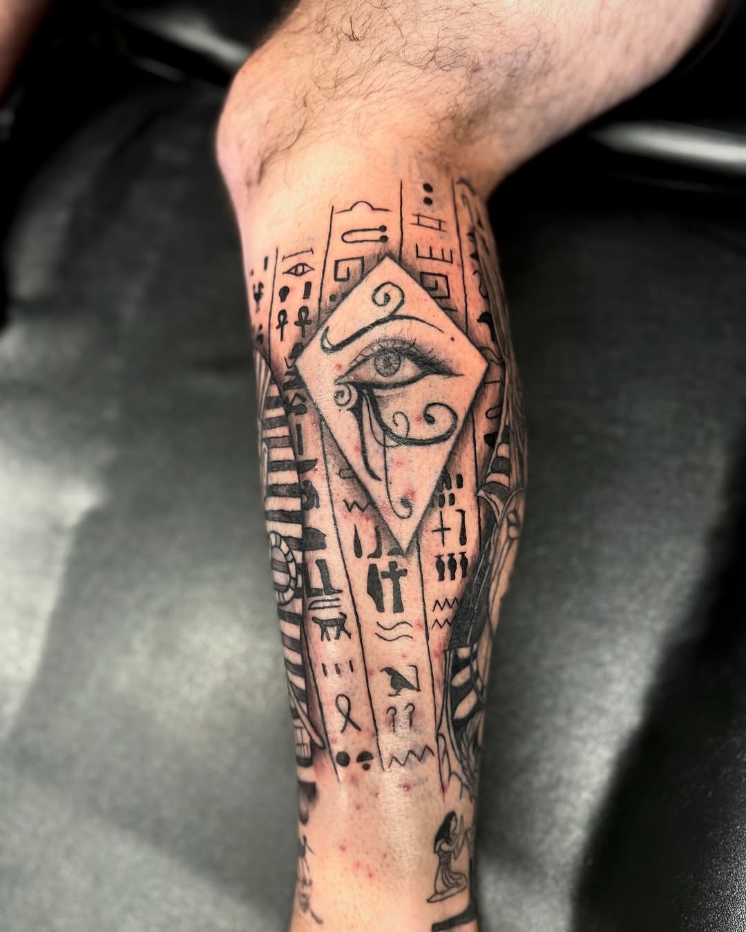Intricate Egyptian Eye Tattoo Design on Leg
