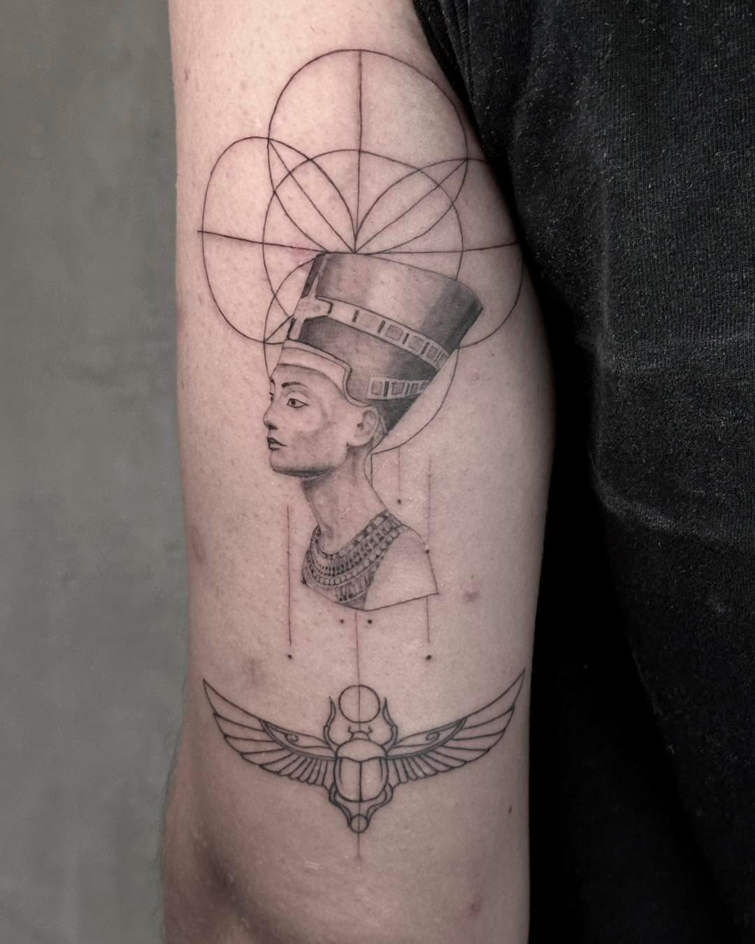 Intricate Egyptian tattoo showcasing Nefertiti's elegance