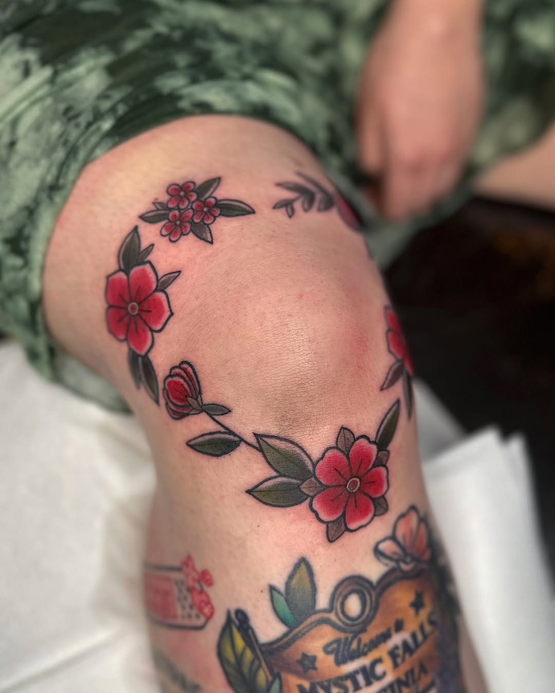 Vibrant Floral Knee Tattoo Design