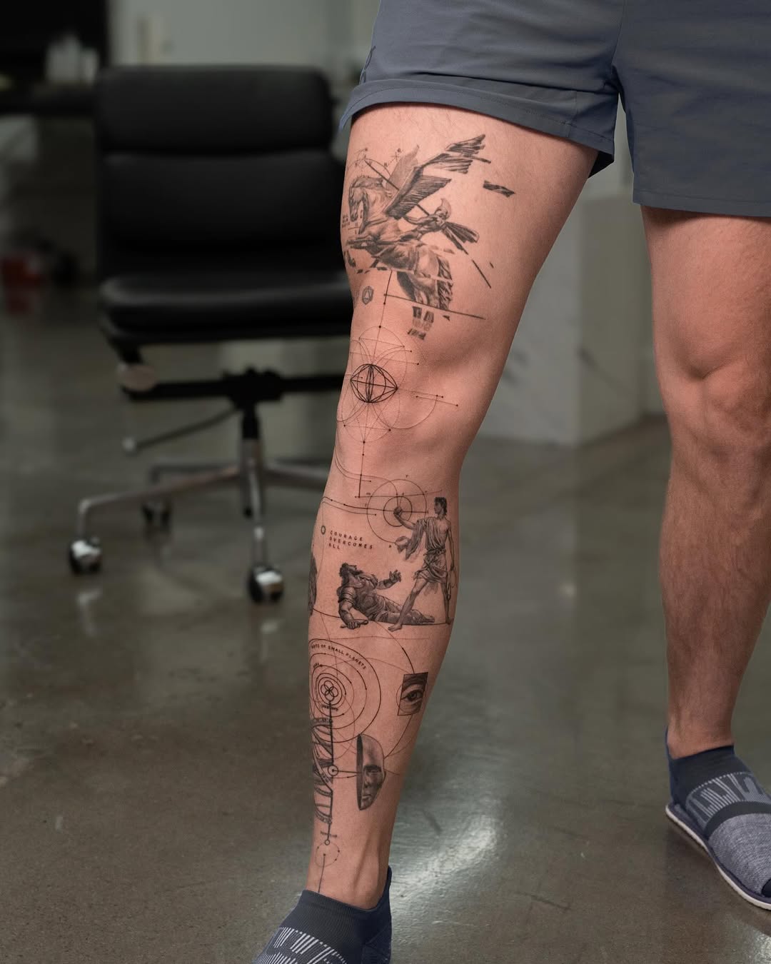 Intricate black ink knee tattoo artwork