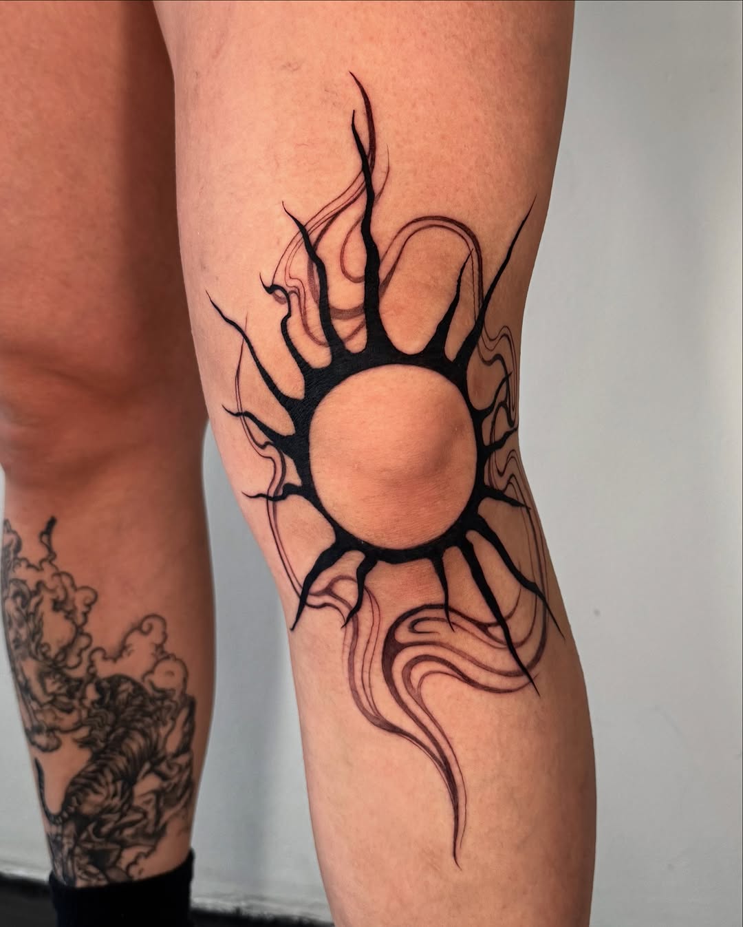 Bold sun tattoo radiating unique energy