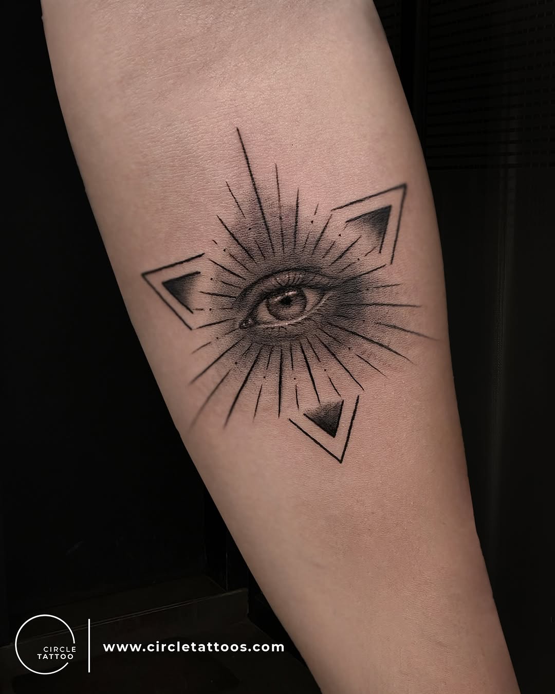Intricate eye tattoo with geometric flair