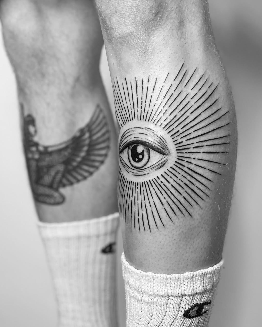 Striking Eye Tattoo with Radiating Lines