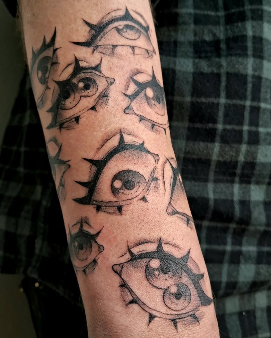 Intricate spiky eye tattoos on display