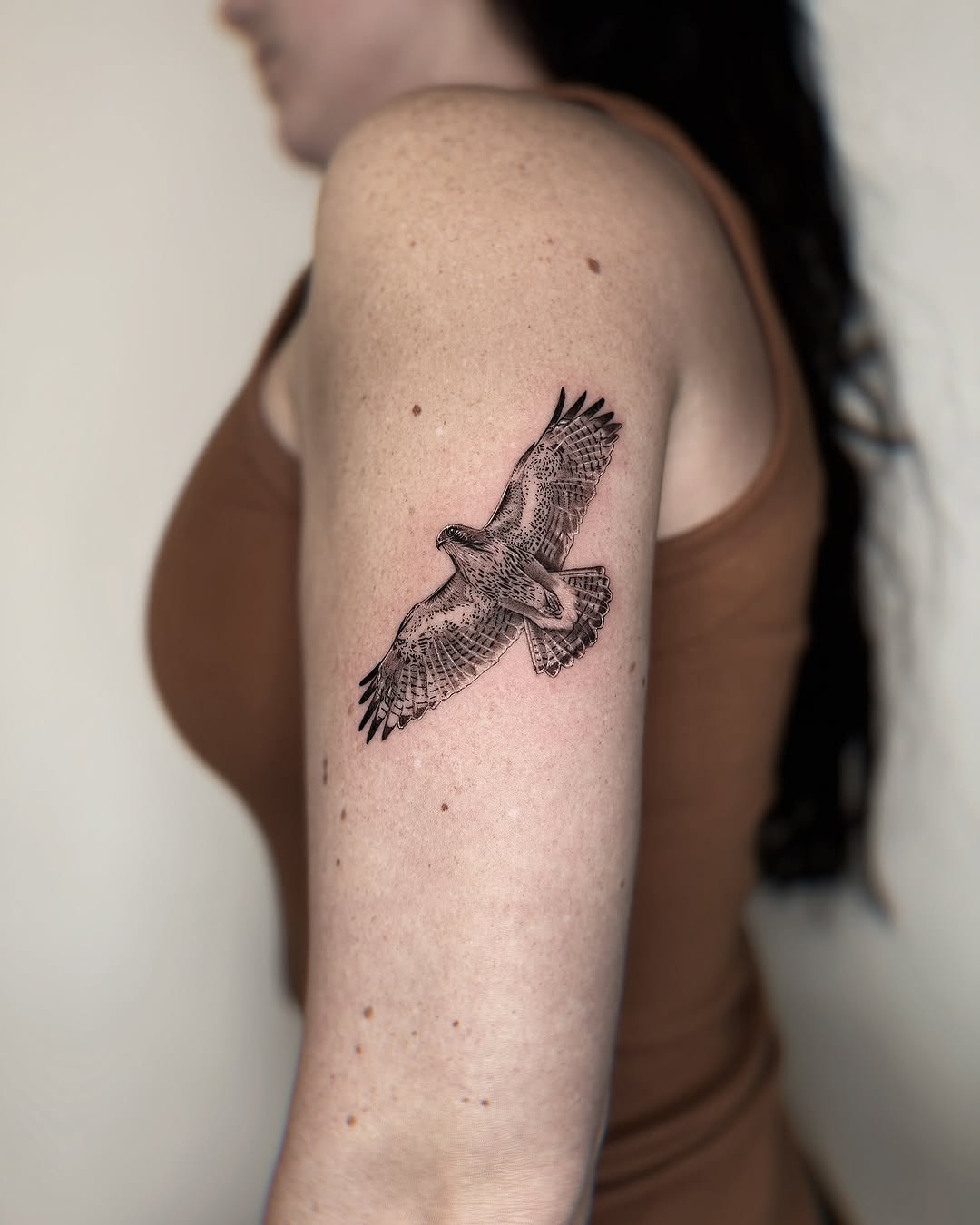Stunning hawk tattoo capturing graceful flight