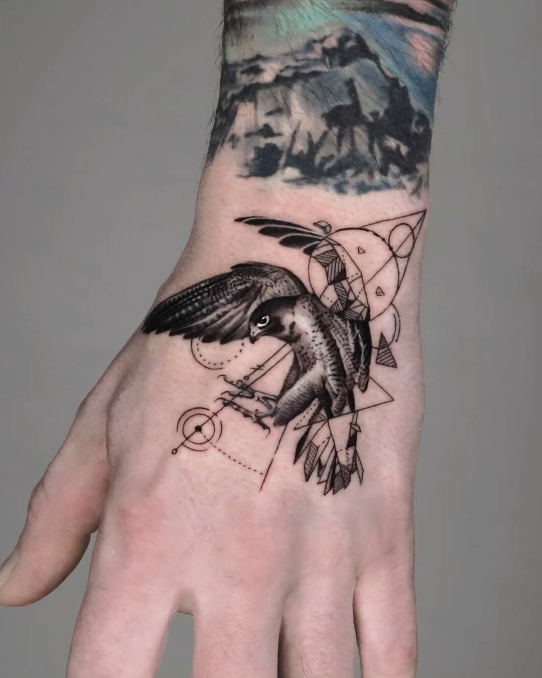 Intricate hawk tattoo with geometric elements