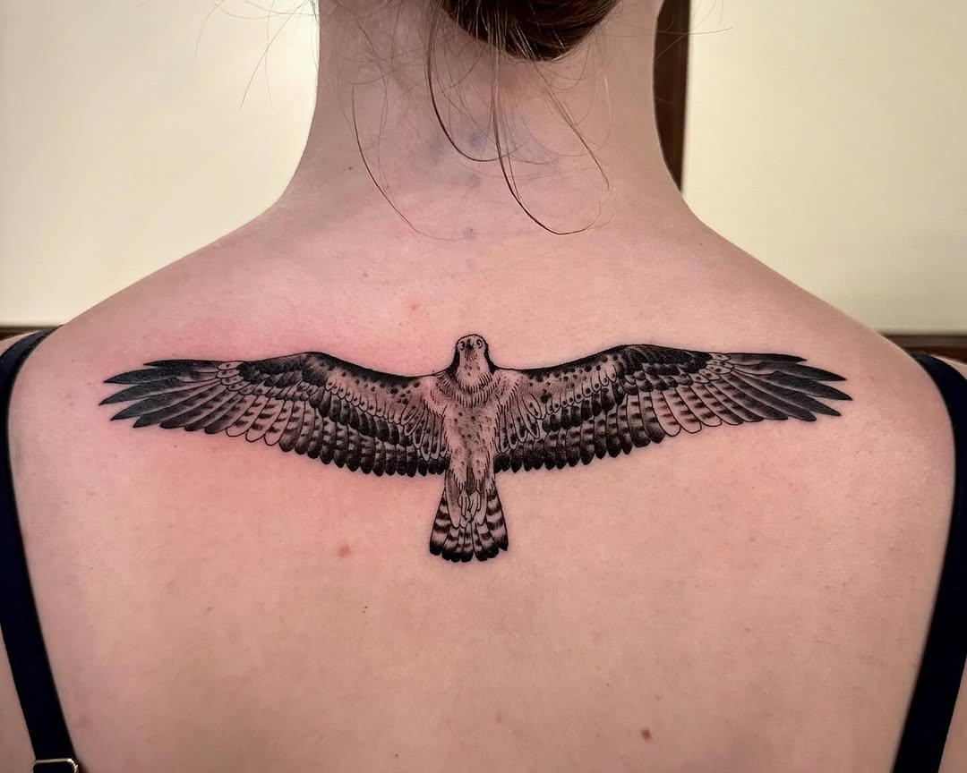 Symbolic hawk tattoo with detailed wingspan