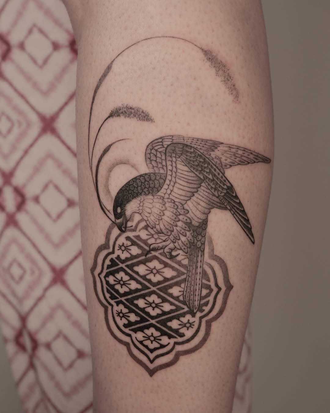 Intricate Hawk Tattoo with Ornate Background