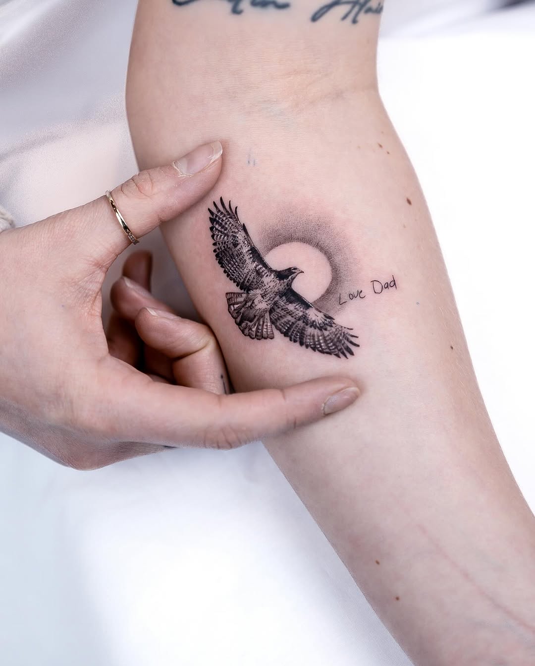 Symbolic Hawk Tattoo with Touching Message