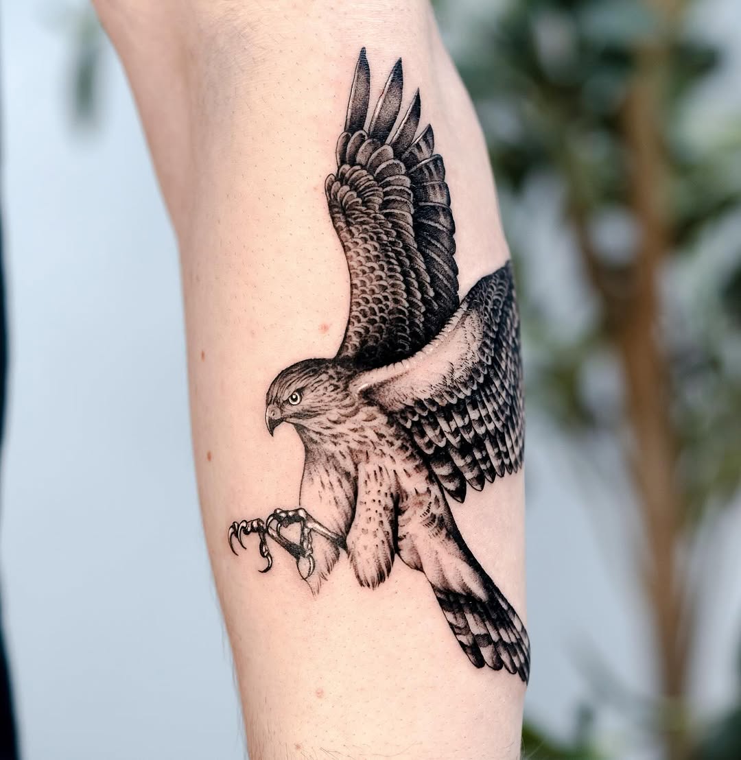 Dynamic hawk tattoo showcasing strength and freedom