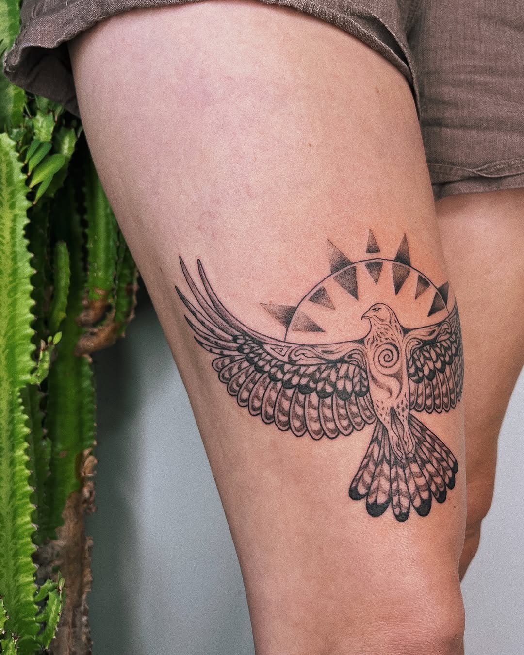 Symbolic hawk tattoo in tribal style