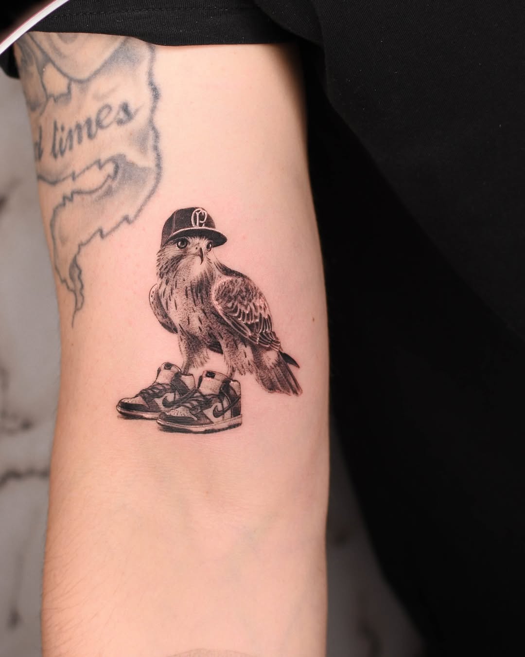 Stylish Hawk Tattoo with Sneakers and Cap