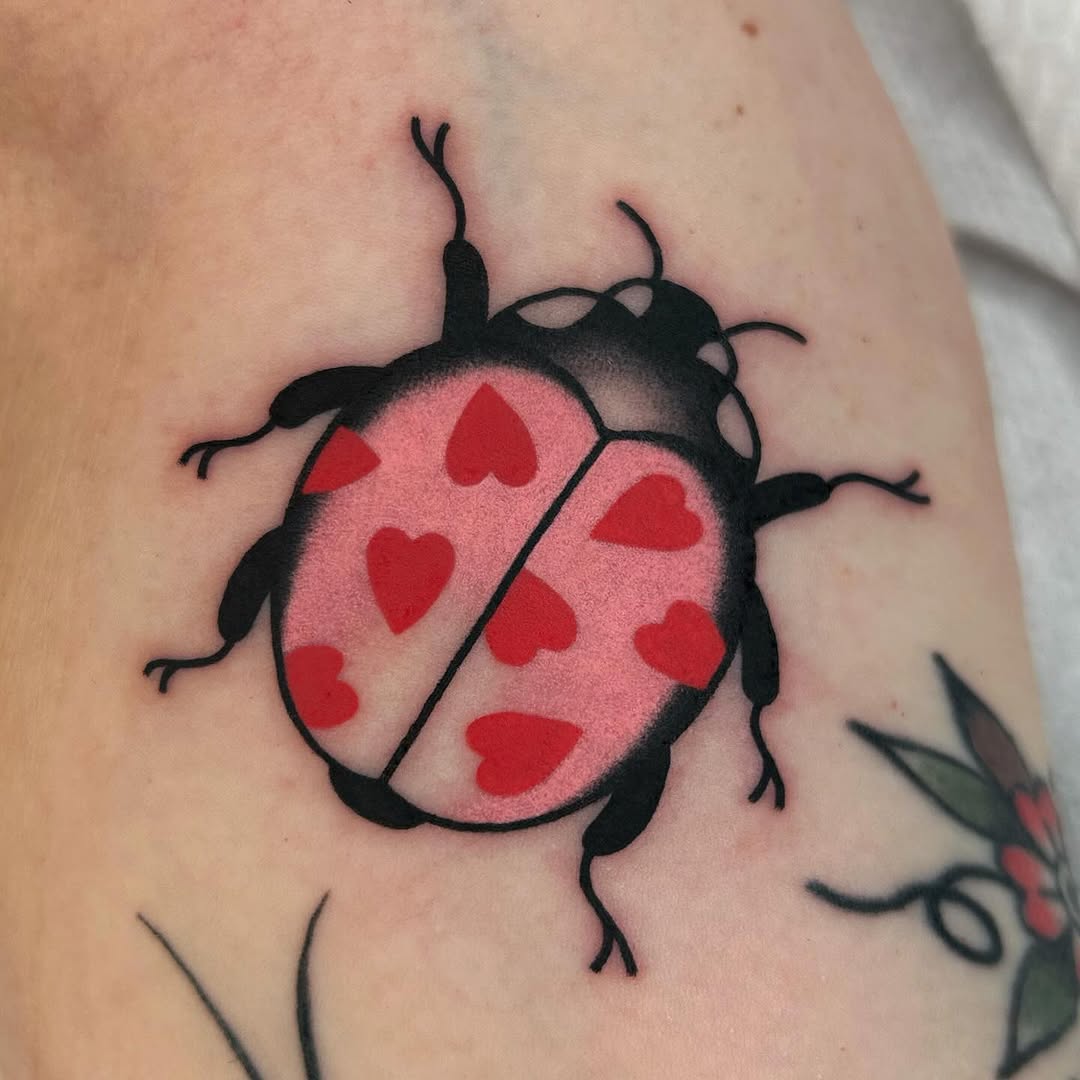 Charming ladybug inked with heart patterns
