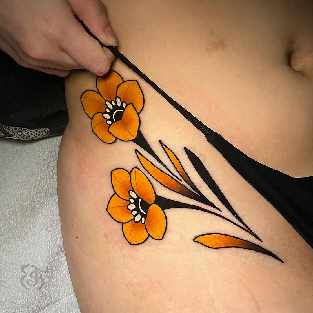 Vibrant floral hip tattoo design