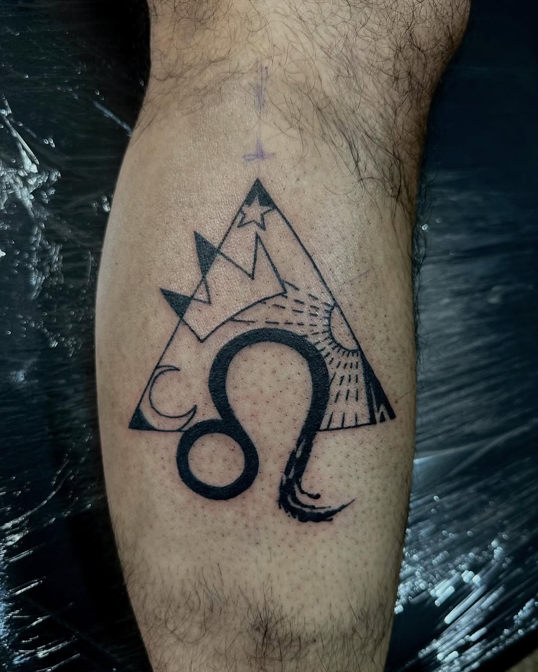 Bold Leo Tattoo with Geometric Shapes