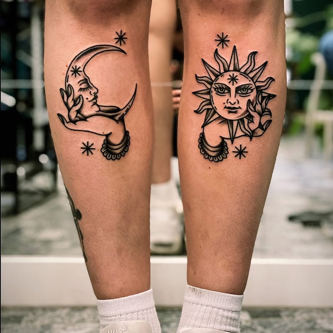 Artful sun and moon hand tattoos on legs