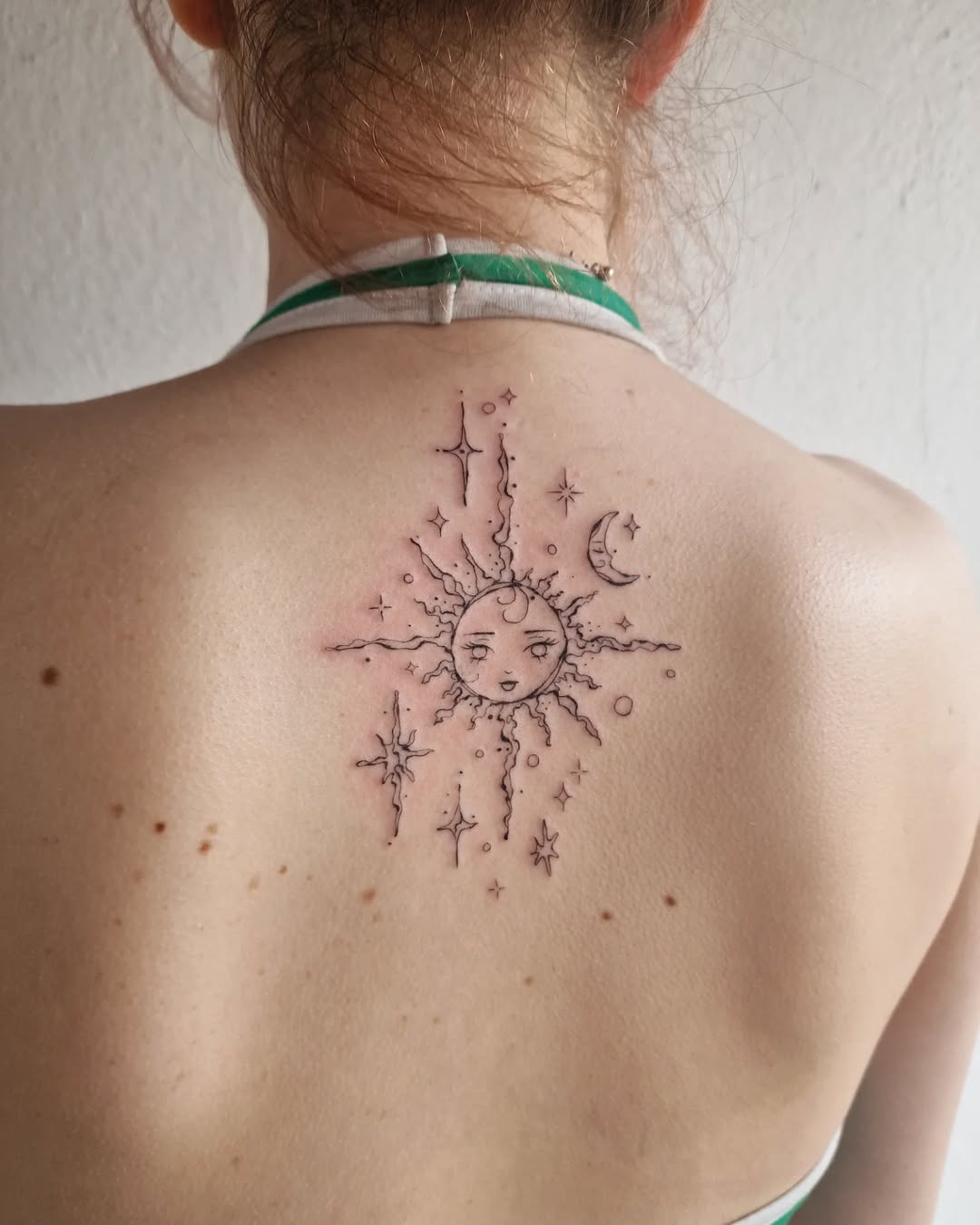 Celestial sun and moon tattoo design