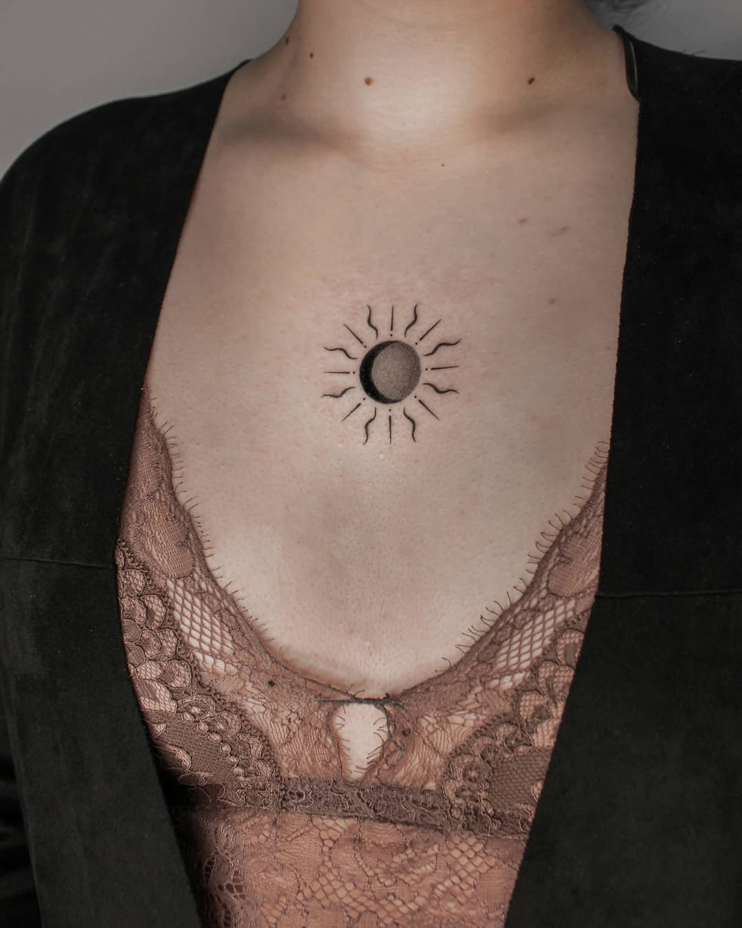 Unique sun and moon chest tattoo design