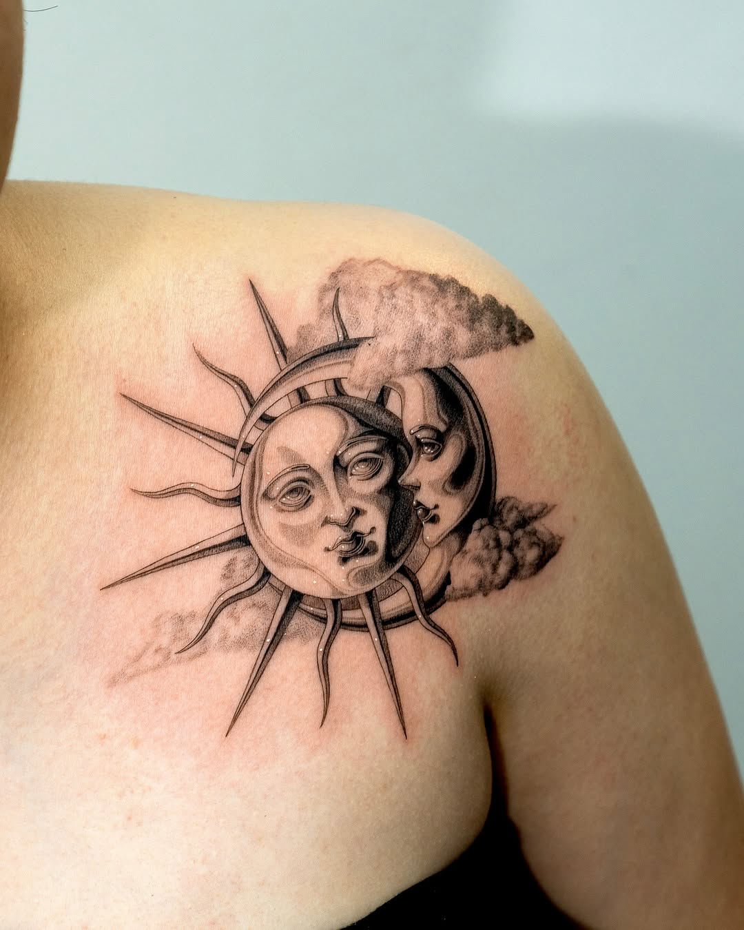 Intricate Sun and Moon Face Tattoo Art
