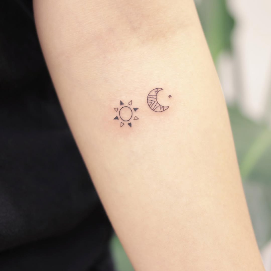 Charming sun and moon tattoo pair on arm