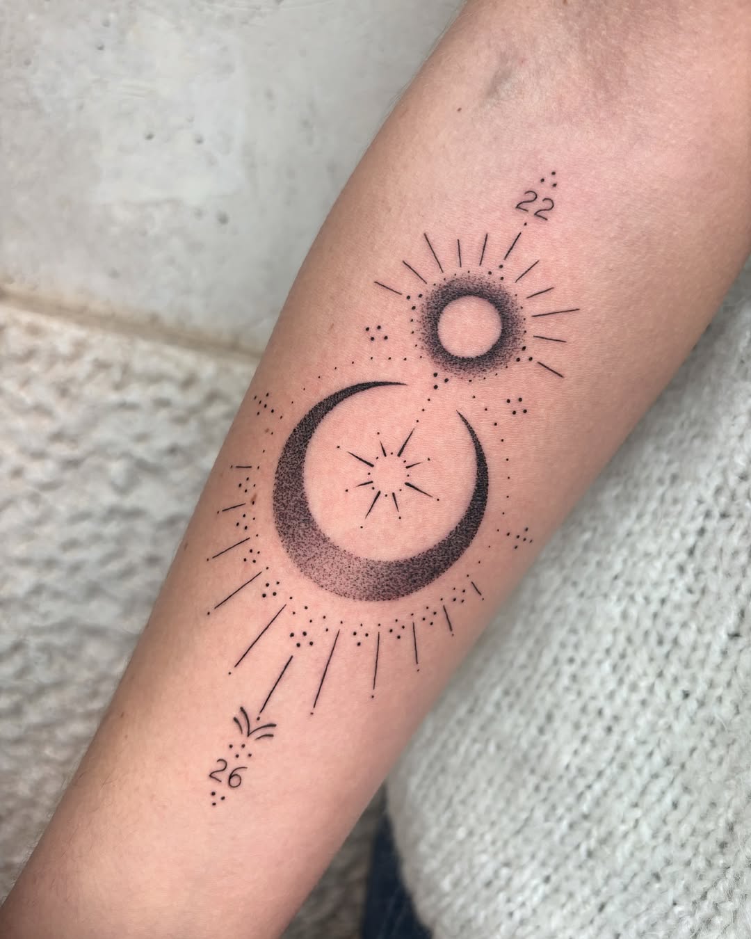 Elegant sun and moon tattoo design with stars