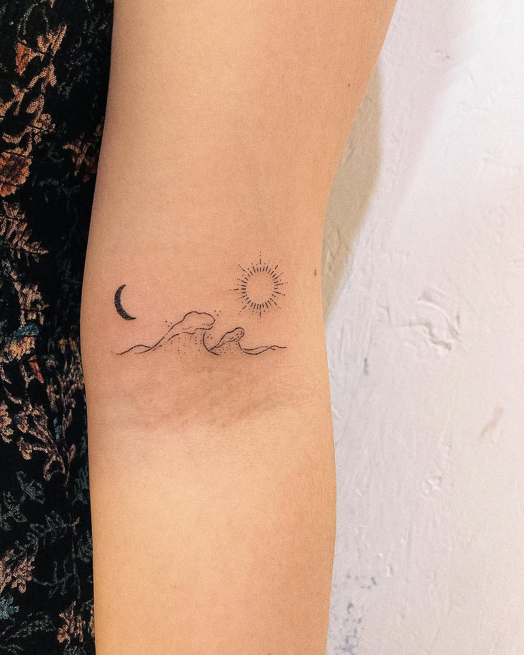 Elegant sun and moon tattoo combination