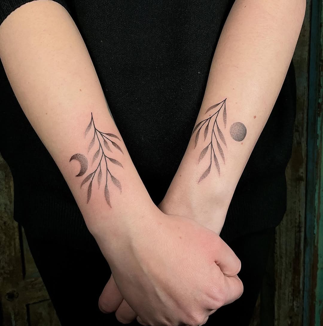 Elegant sun and moon leafy tattoo design