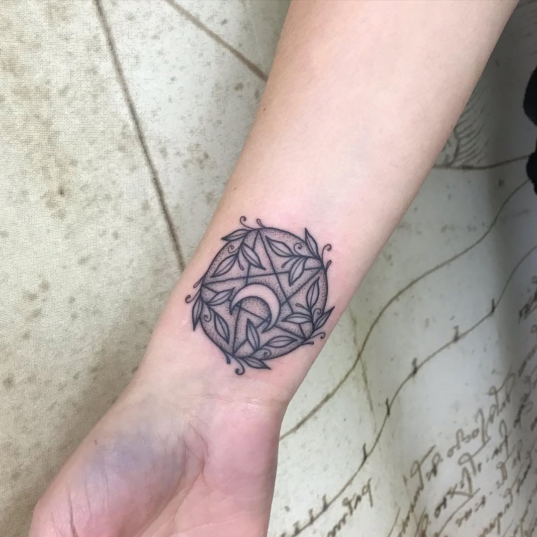 Intricate witchy tattoo with lunar symbolism