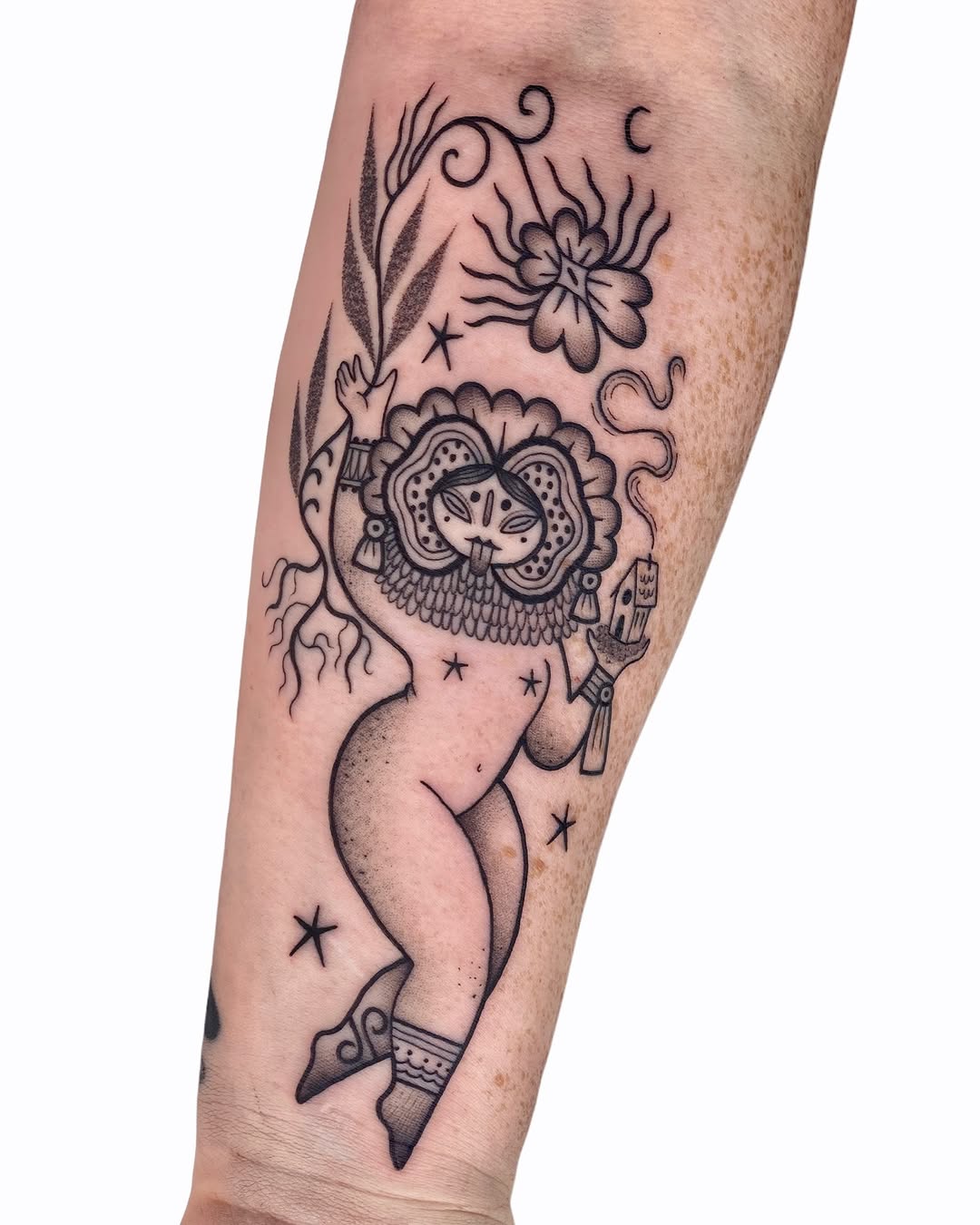 Enchanting female figure with natural elements tattoo