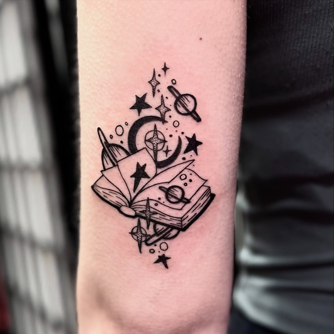 Cosmic Book Tattoo with Celestial Elements