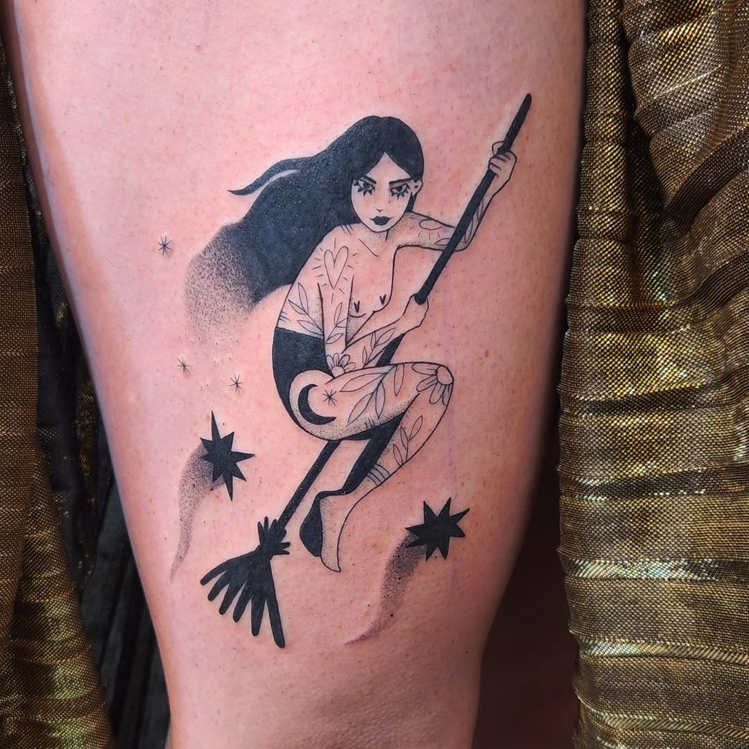 Enchanting witch tattoo with celestial elements