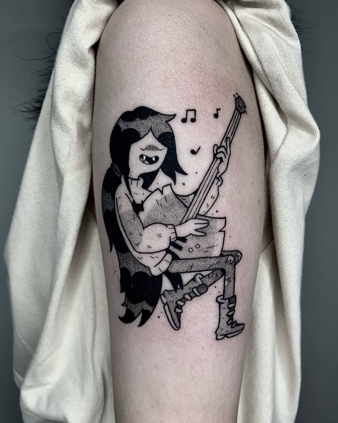Charming witchy music tattoo for creative souls