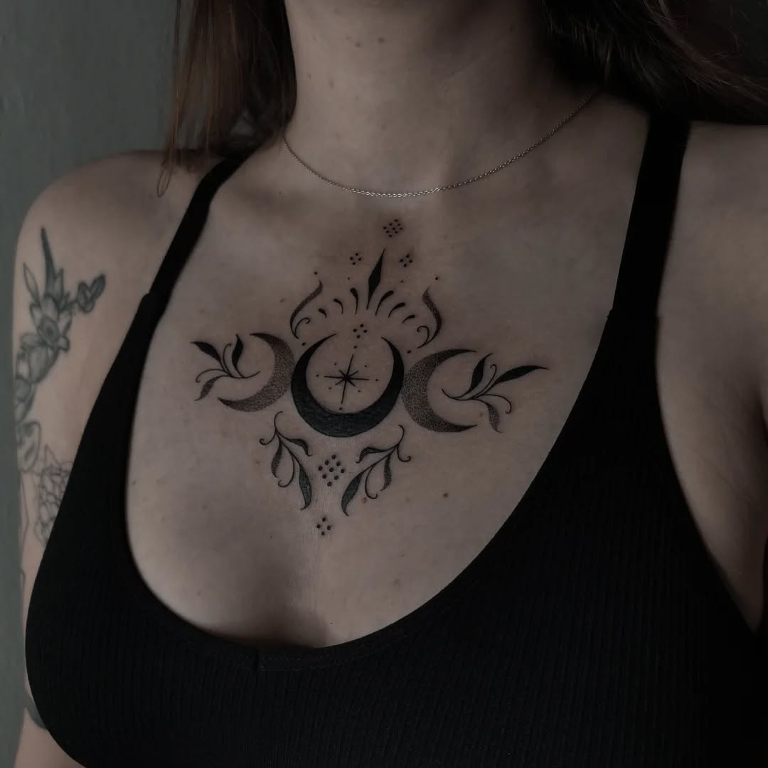 Mystical moon and floral tattoo design