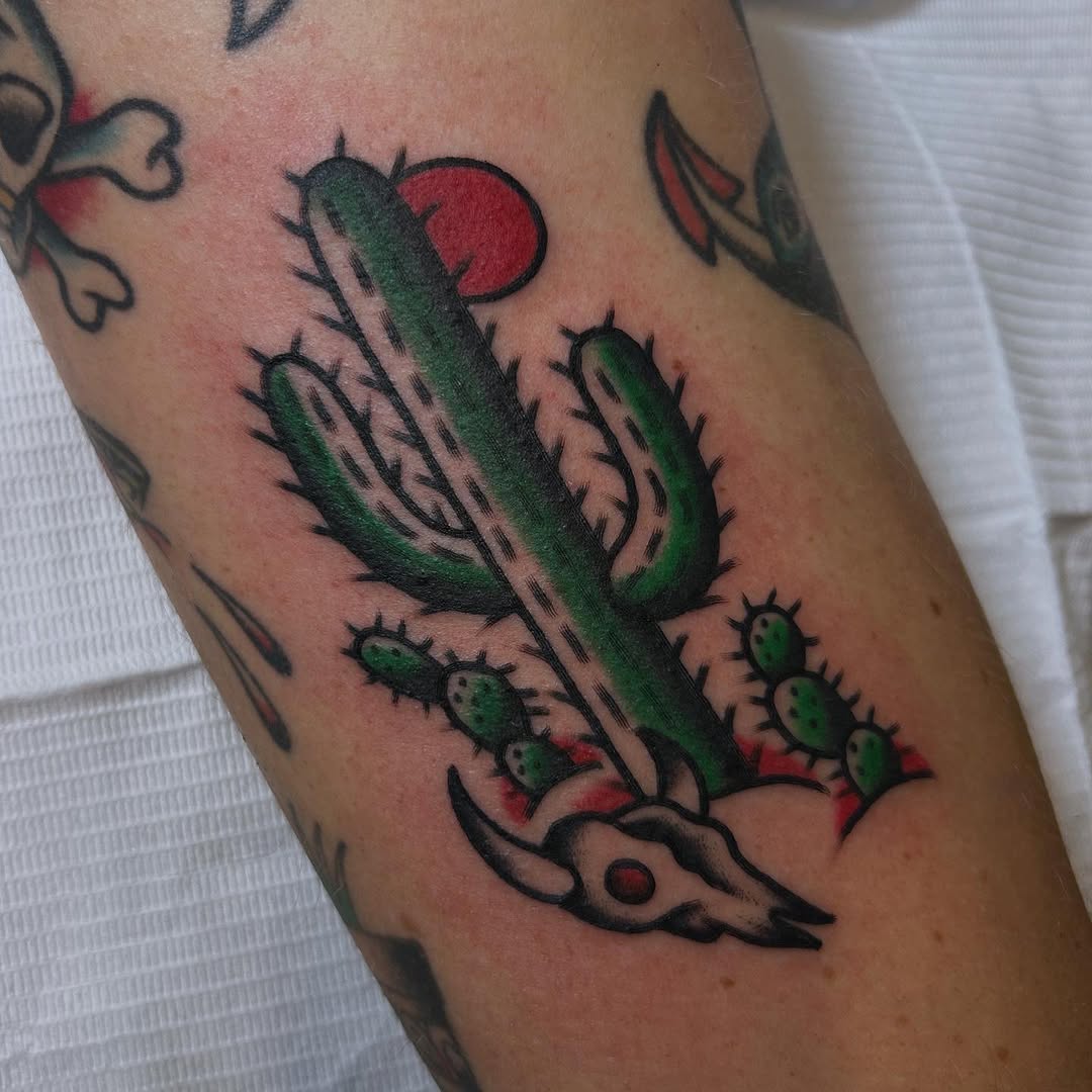 Vibrant cactus tattoo with skull elements