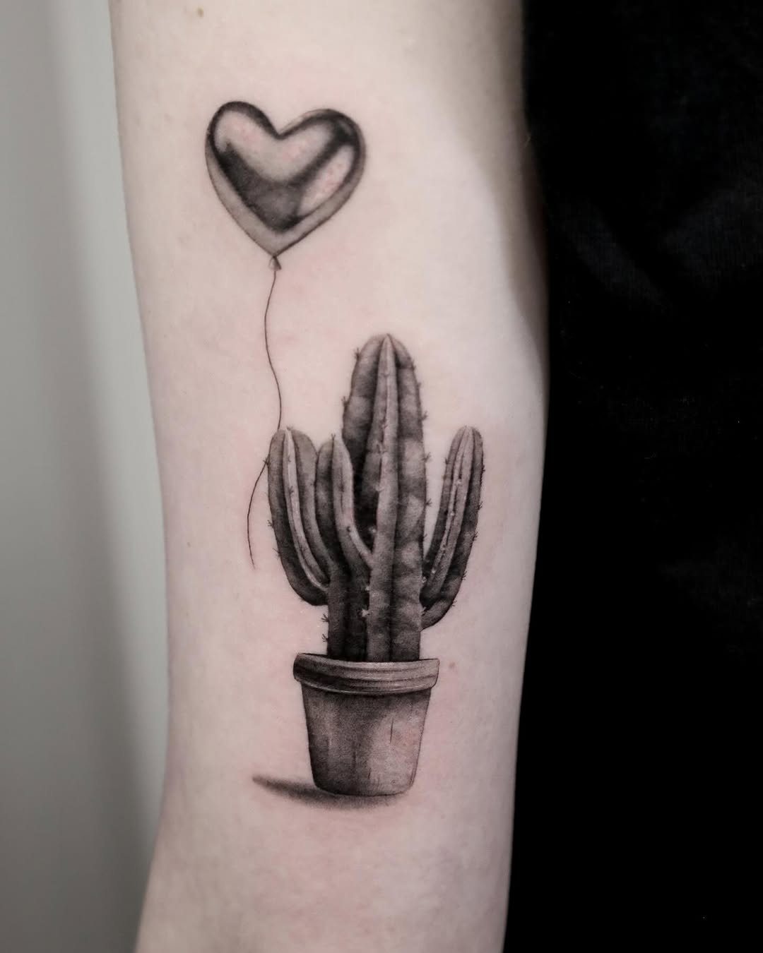 Charming cactus design with heart balloon