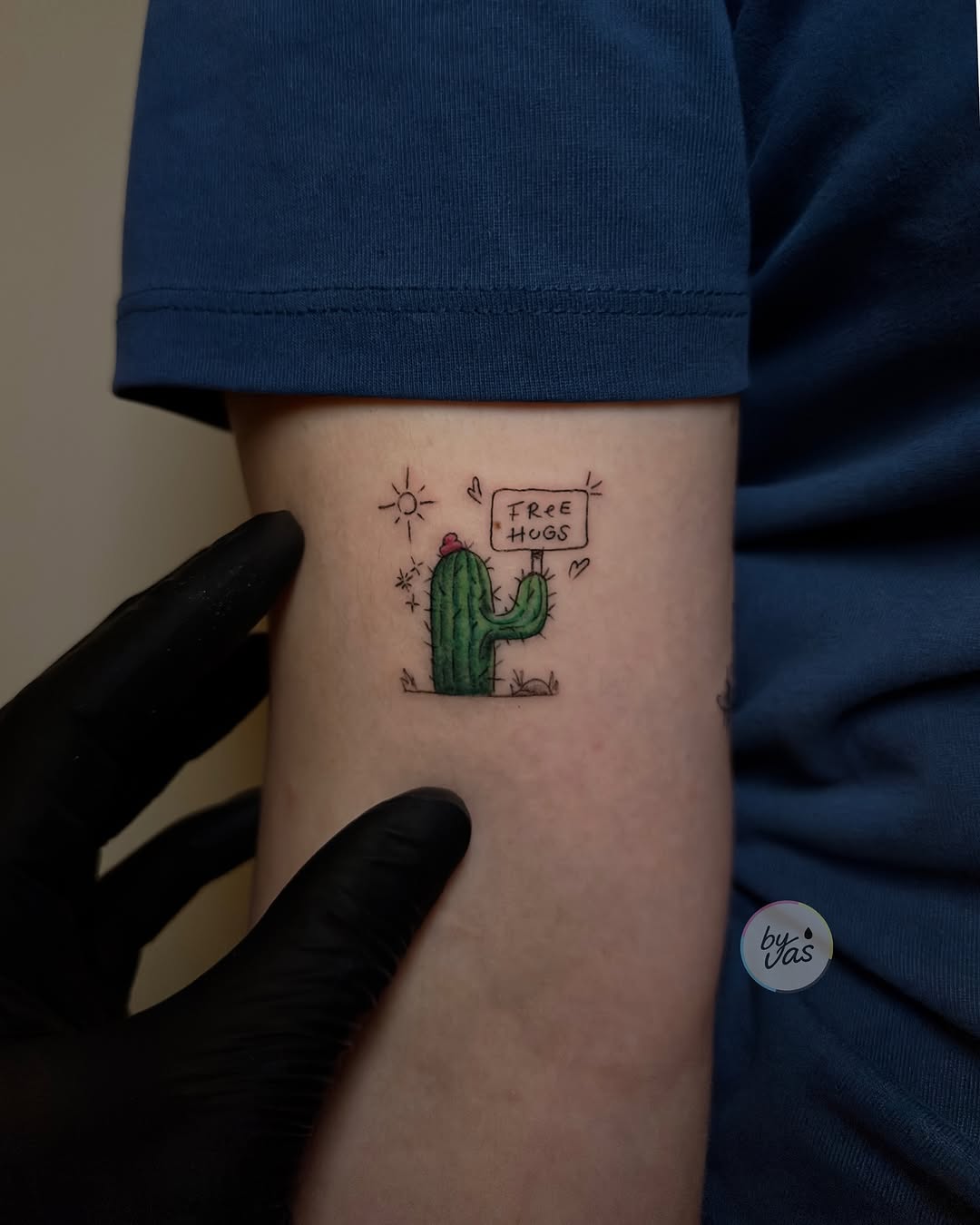 Cute cactus tattoo offering free hugs