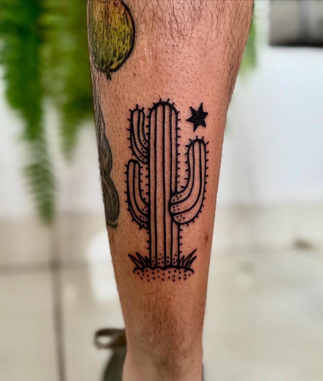 Elegant black ink cactus tattoo design