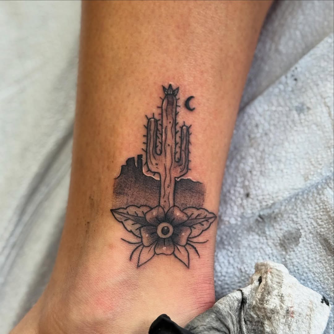 Stylish cactus tattoo with floral elements