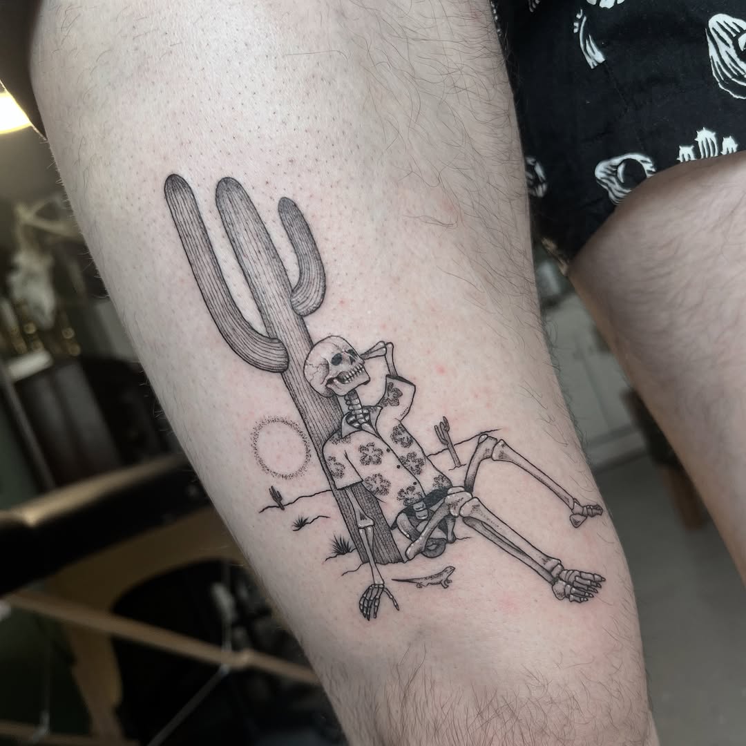 Charming cactus tattoo with skeleton motif