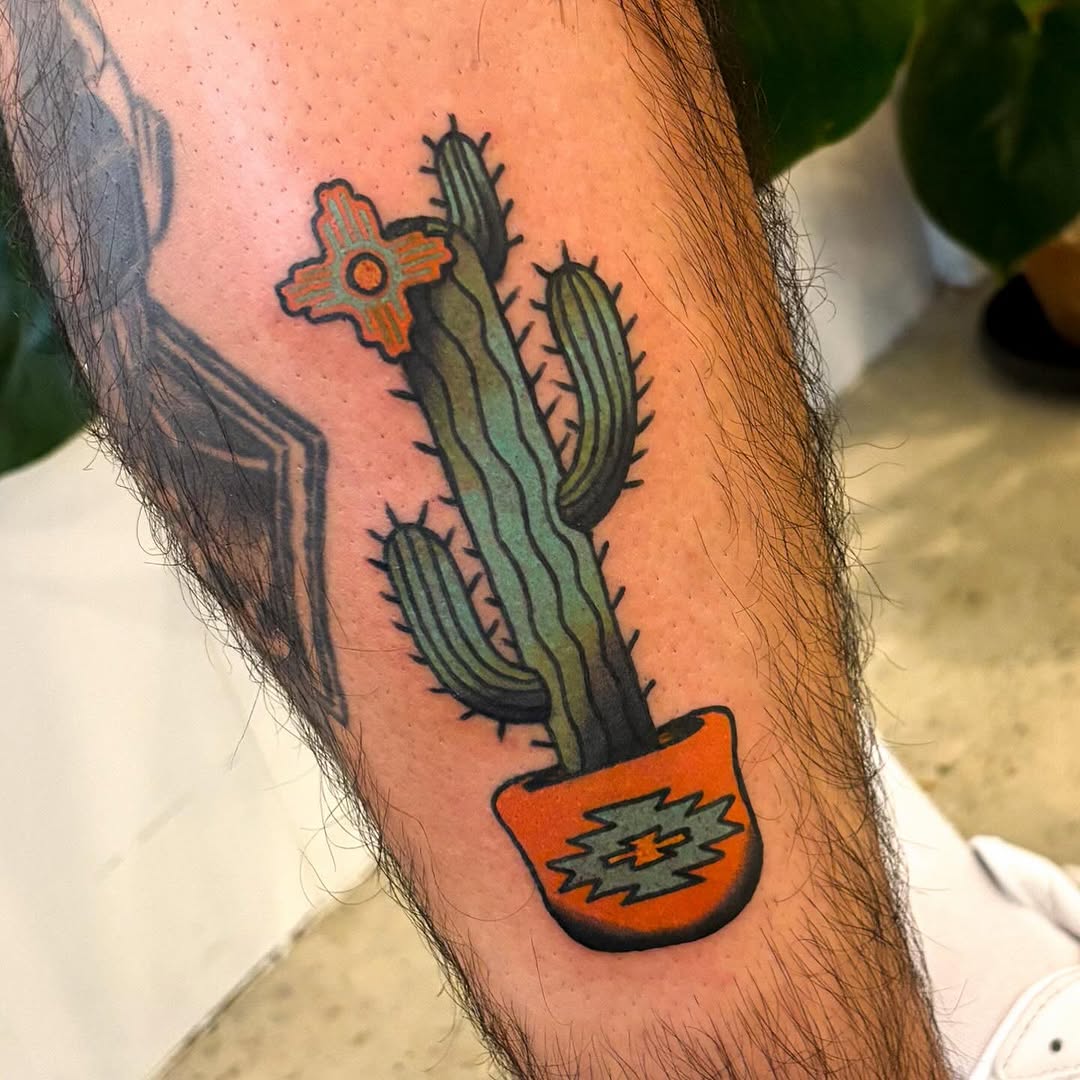 Vibrant cactus tattoo in decorative pot