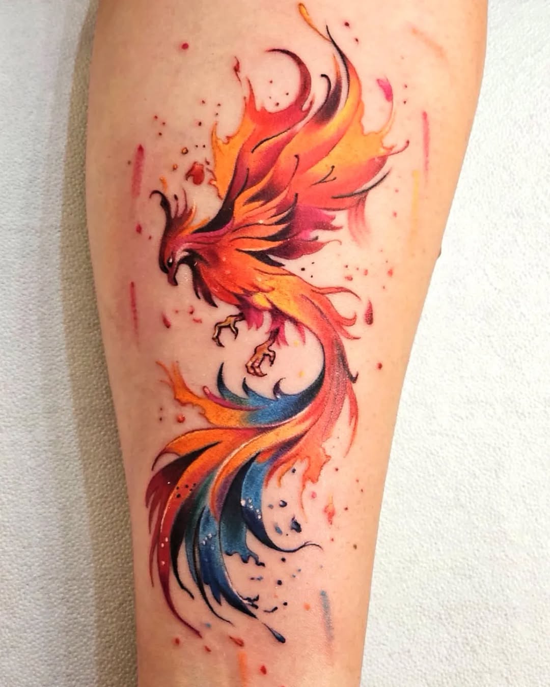 Stunning vibrant phoenix tattoo in motion.