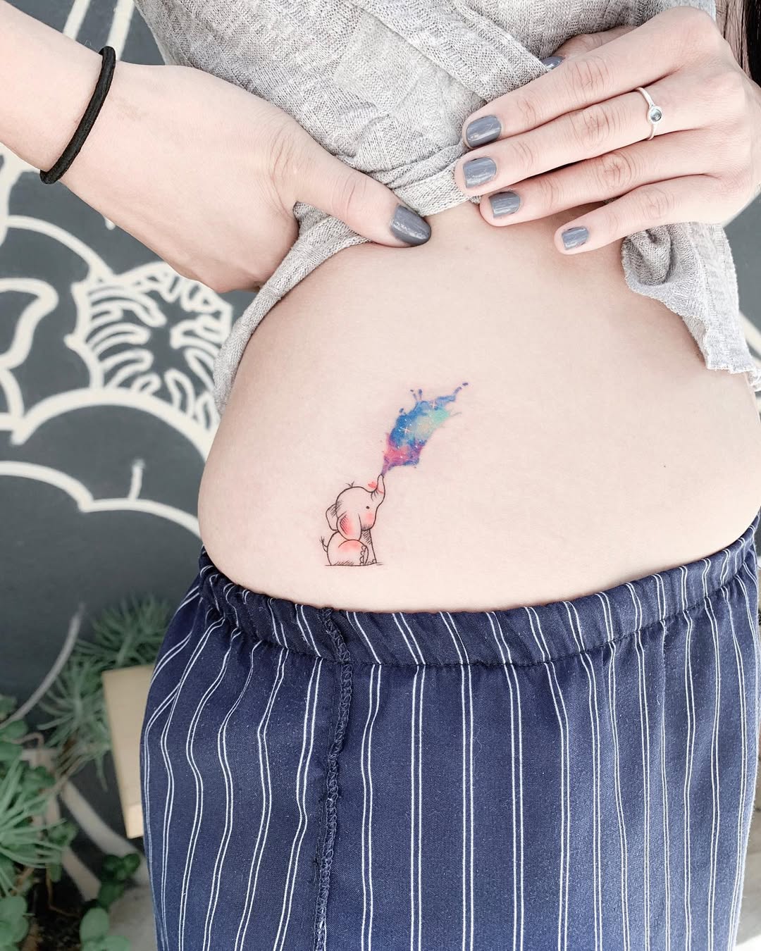 Whimsical watercolor elephant tattoo design
