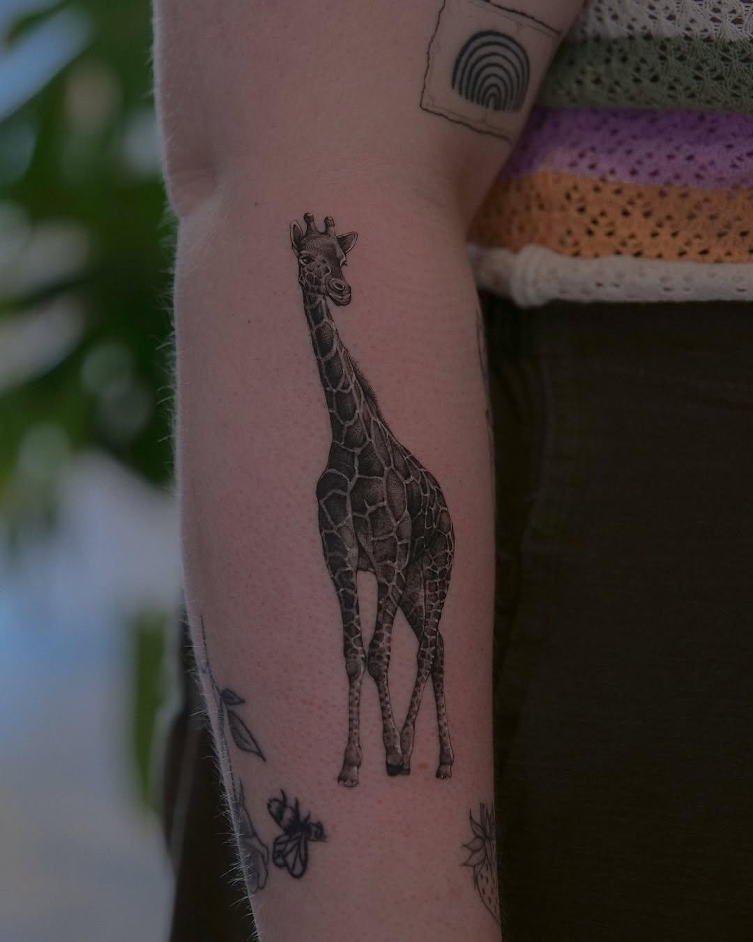 Elegant Giraffe Tattoo on Forearm