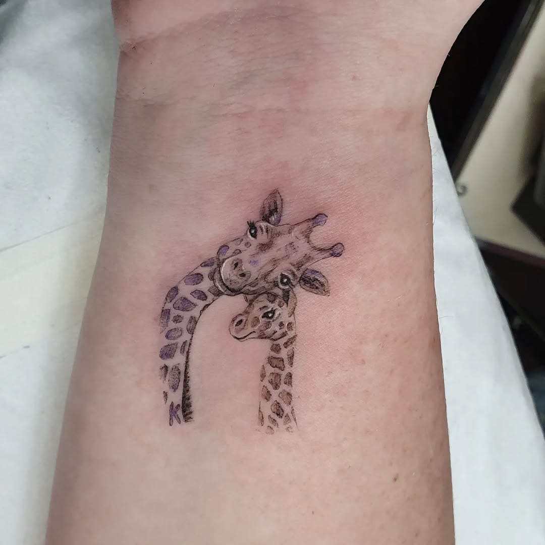 Playful Giraffe Tattoo Showcasing Connection