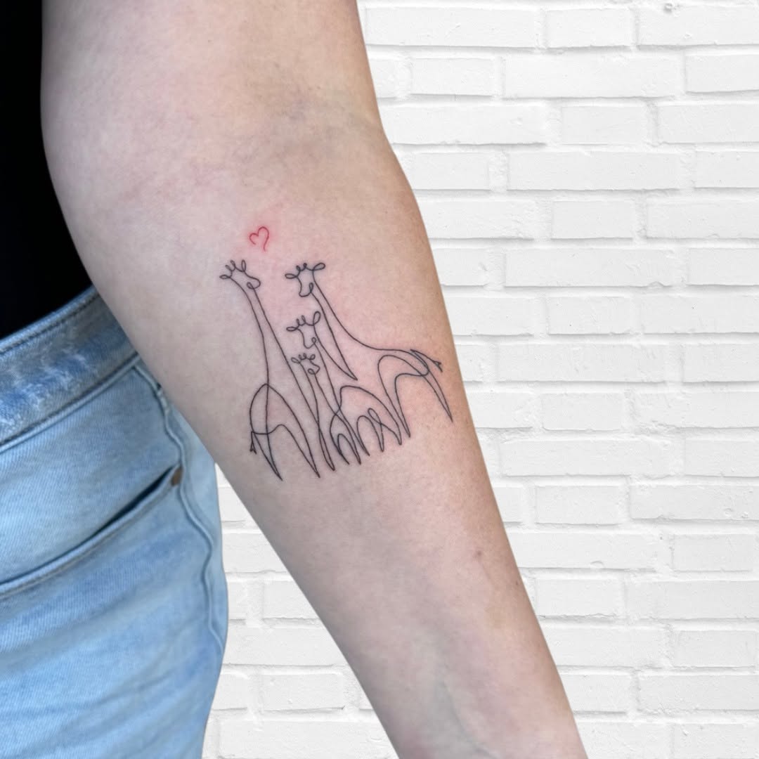 Charming minimalist giraffe tattoo with heart