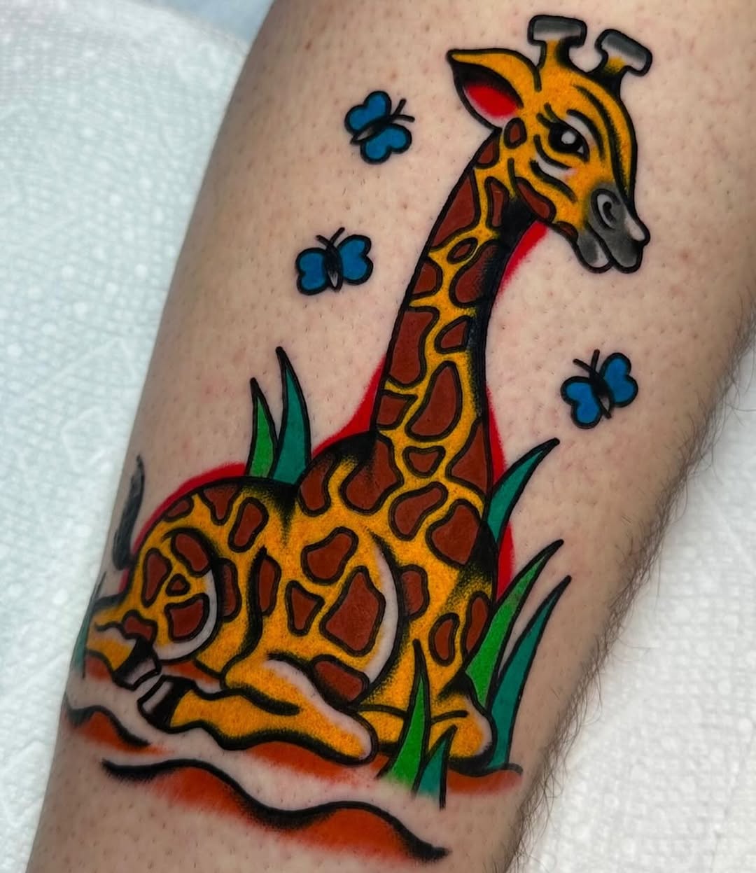 Colorful Giraffe Tattoo Surrounded by Butterflies