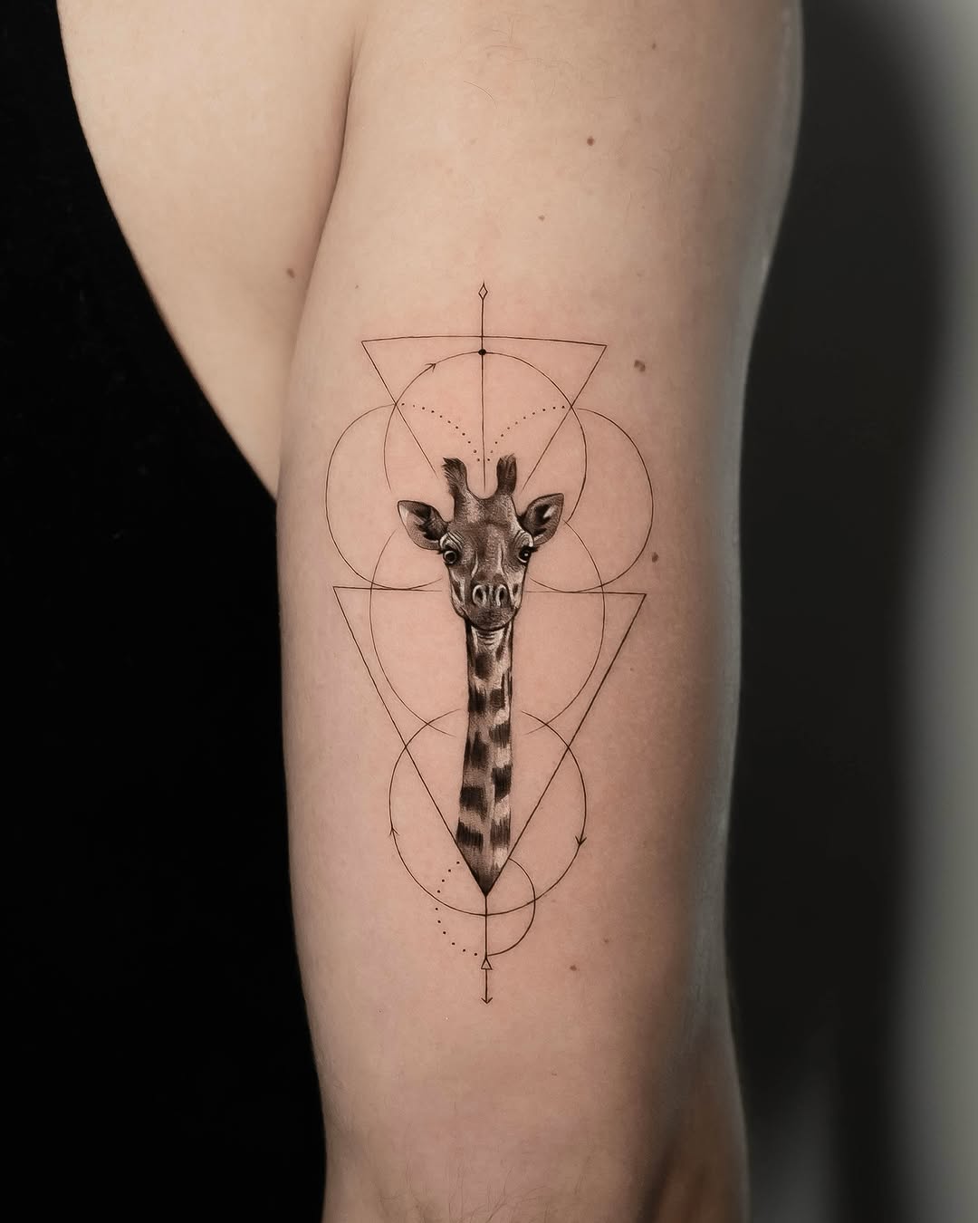Geometric giraffe tattoo with intricate design elements
