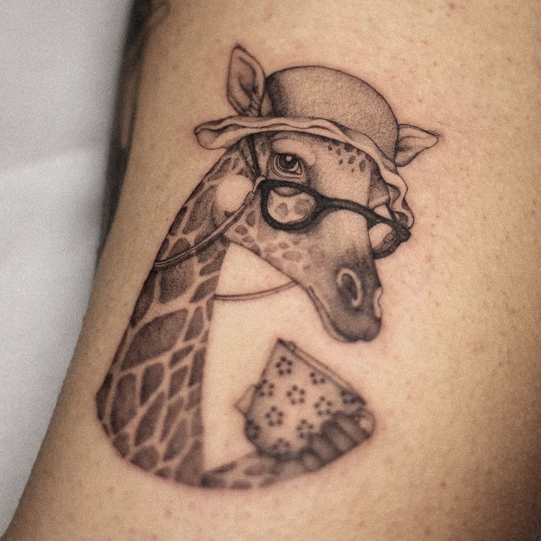 Adorable giraffe tattoo with vintage accessories