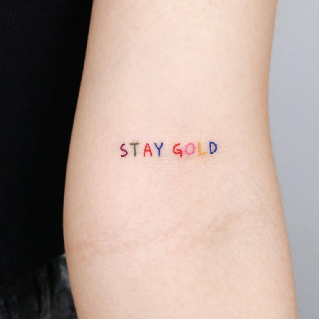 Colorful quote tattoo with a timeless message